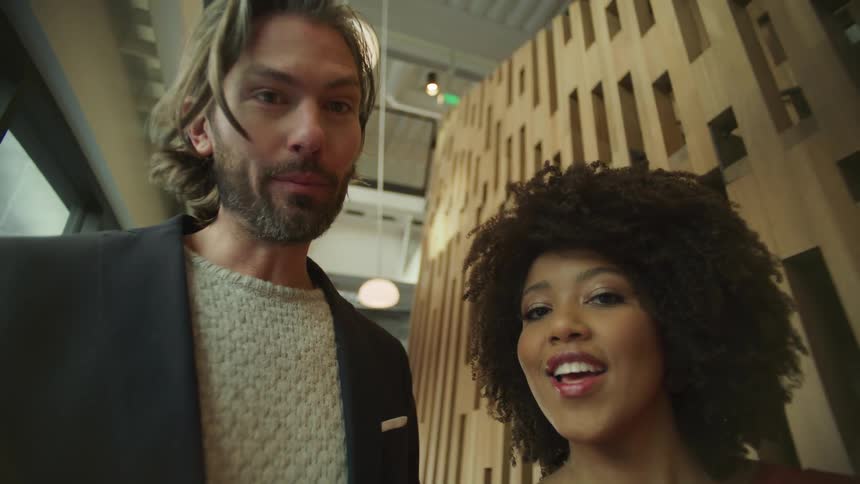 Man and woman are walking together in a building