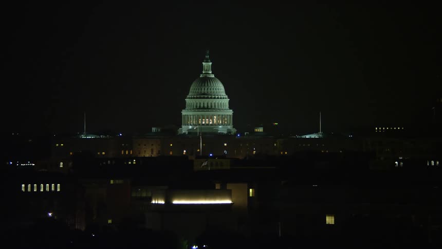 Aerial footage of the iconic United States Capitol building in Washington DC at night