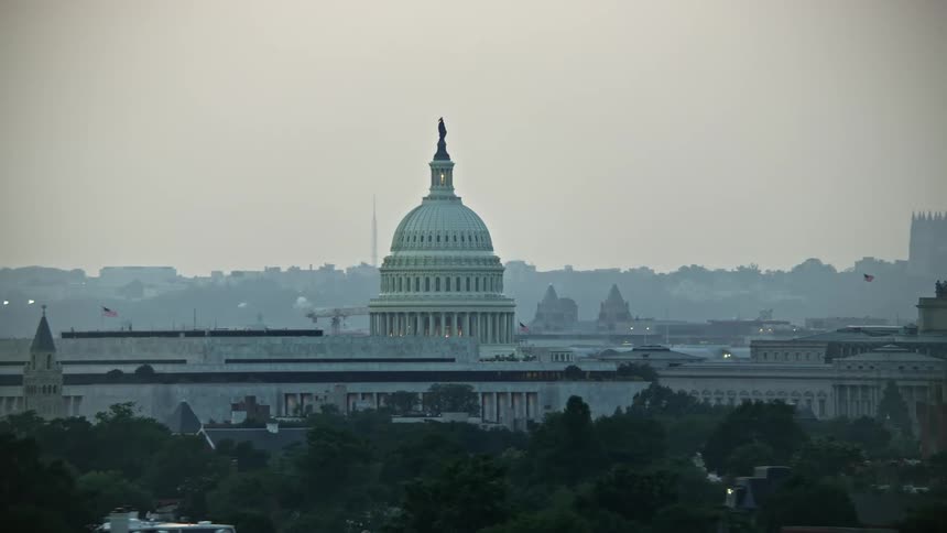 Aerial footage at twilight of the United States Capitol dome and the Thomas Jefferson Building in Washington DC between James Madison and Thomas Jefferson buildings
