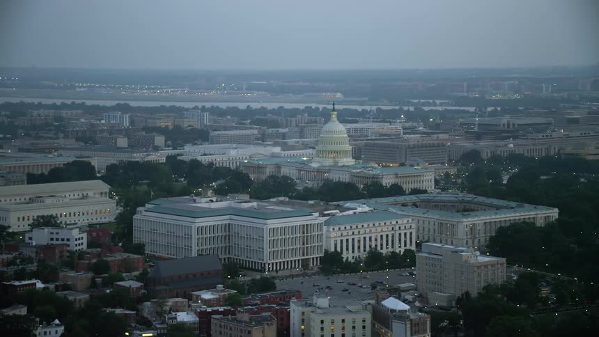 A stunning twilight aerial shot of the United States Capitol set behind the iconic Russell Dirksen and Hart Senate Office Buildings in Washington DC