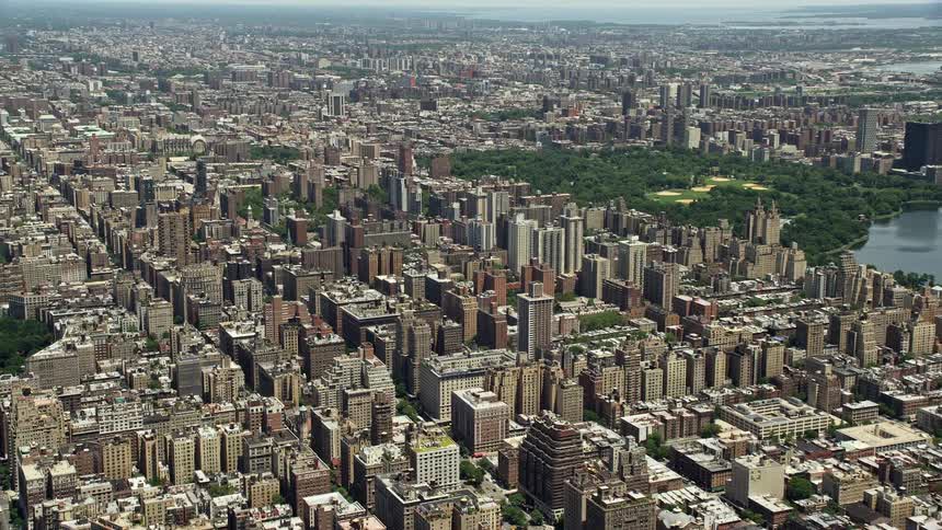 A stunning aerial view of Upper West Side high-rises and wide avenues in New York City during summertime