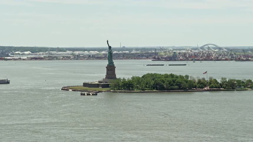 An aerial view of Statue of Liberty on a sunny day in New York Harbor New York City captured during summer