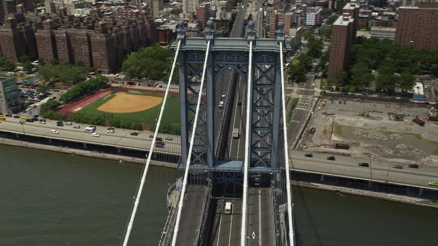 Aerial footage showing light traffic passing on the Manhattan Bridge in New York City during the day