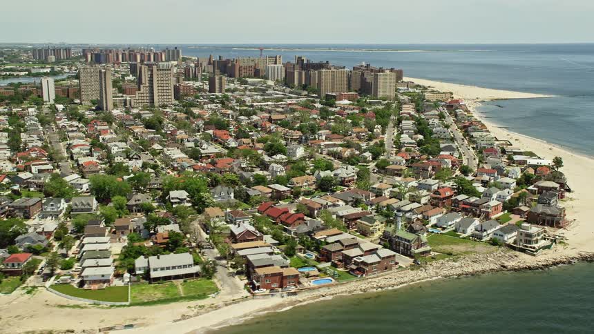 A stunning aerial view of the vibrant seaside neighborhood and beaches of Coney Island Brooklyn providing an exciting new perspective of the summer holidays in New York City