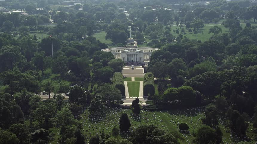 Approaching the Tomb of the Unknown Soldier at Arlington National Cemetery in Washington DC during daytime aerial footage