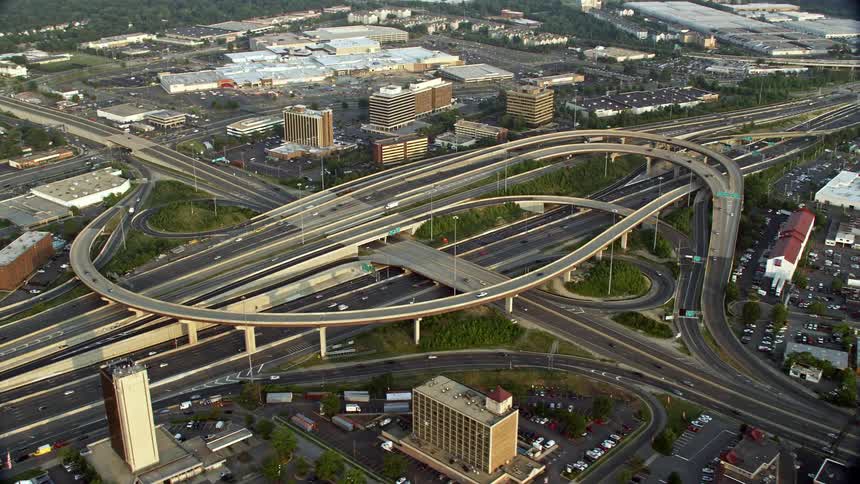 An aerial shot of Interstate 95 Interchange at sunset with light traffic and hazy transportation in Springfield Virginia