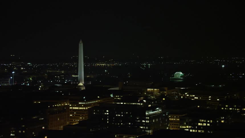A stunning aerial view of the Washington Monument and Jefferson Memorial at night in Washington DC