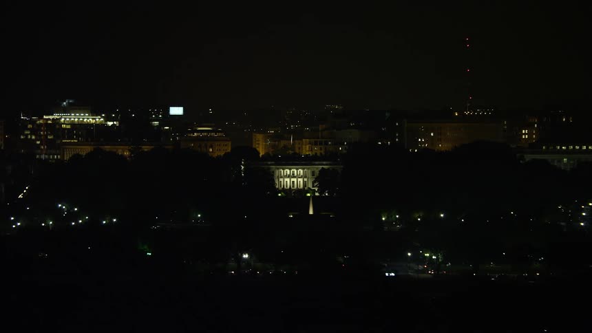 Aerial footage of The White House at night in Washington DC