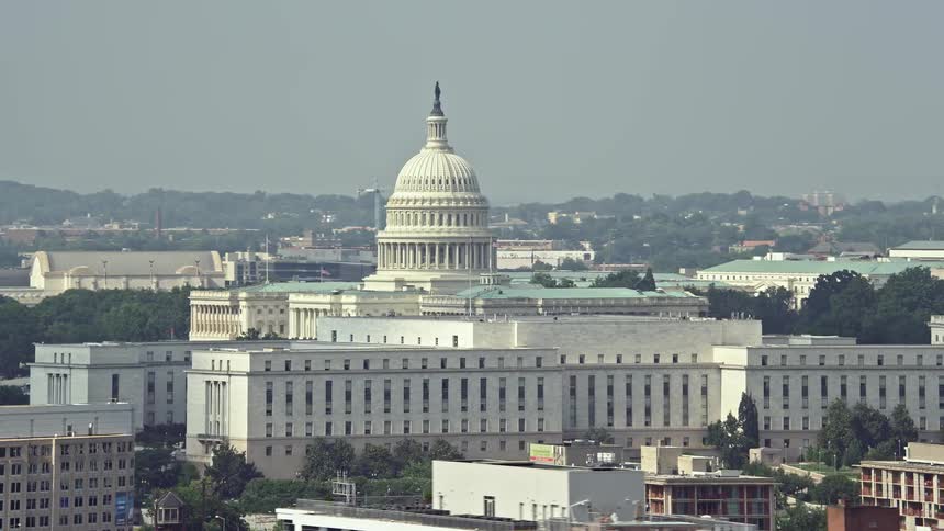 An aerial view of the United States Capitol and Rayburn House Office Building in Washington DC during summer