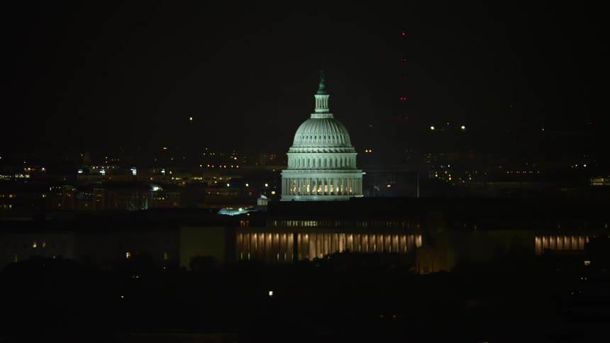 An aerial view of the United States Capitol building at night in Washington DC showcasing its iconic structure and landmark status while also highlighting the leisure and entertainment activities surrounding it