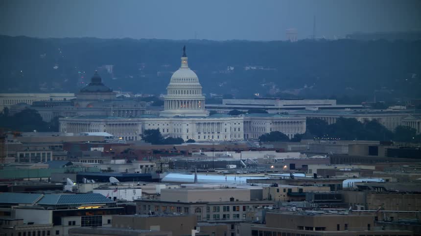 An aerial view of the Thomas Jefferson Building and United States Capitol building seen from Georgetown Washington DC during twilight