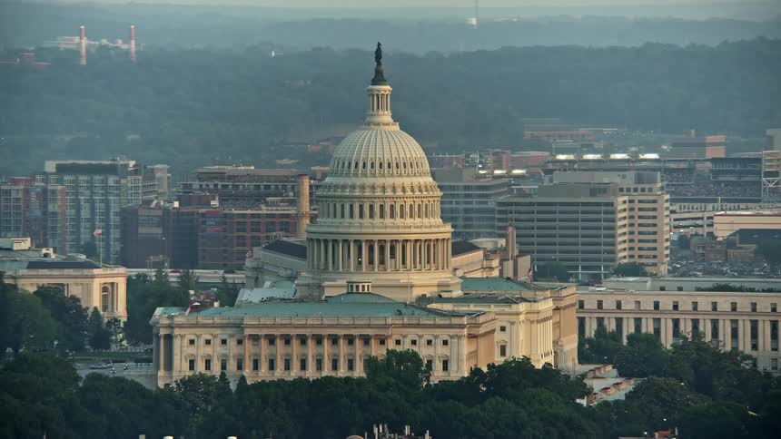A breathtaking aerial view of the iconic United States Capitol building in Washington DC during sunset