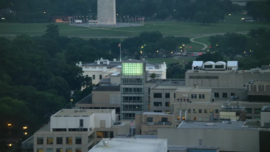 A breathtaking twilight aerial view captures the iconic White House and North Lawn Fountain in Washington DC