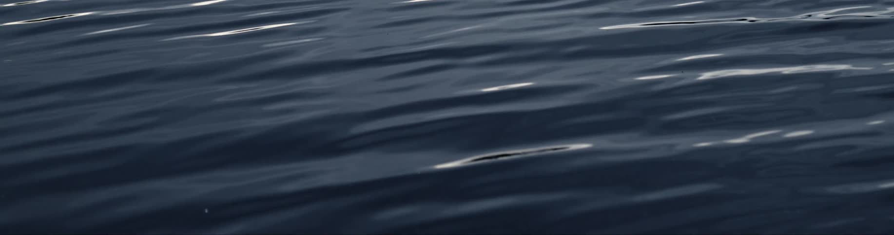 Blue water reflecting and rippling