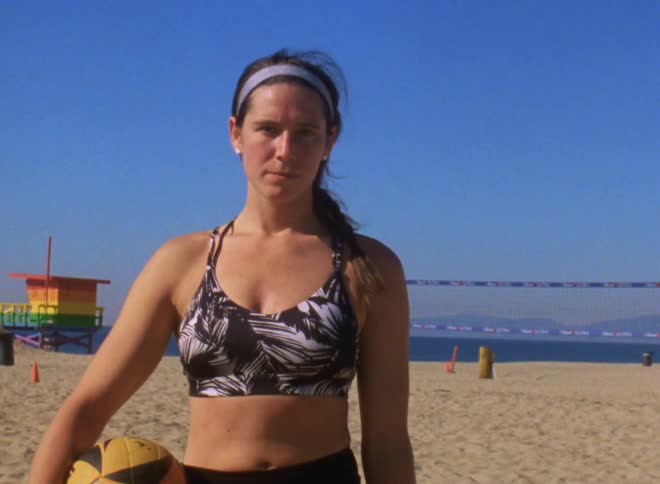 A closeup of a female volleyball player