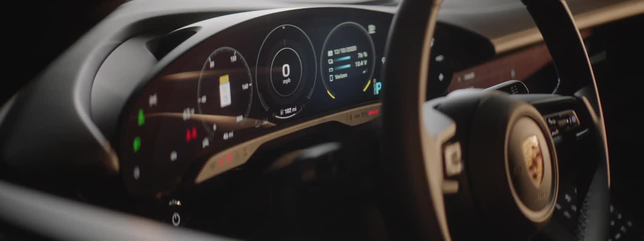The electronic dashboard of a sports car lights up