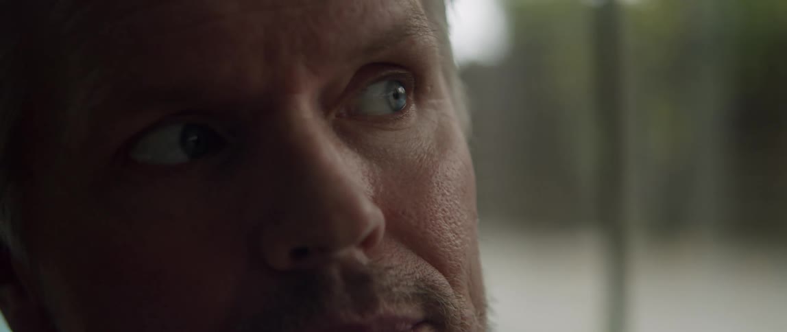Close up of middle aged mans face looking around in the room