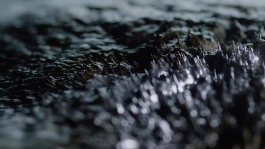 An up close of liquid moving slowly
