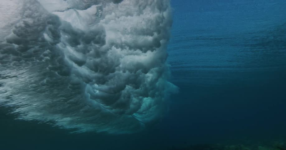 Ocean wave moves across the surface of ocean