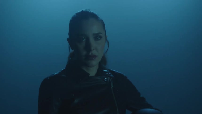 Close of shot of a woman surrounded by strobe lights