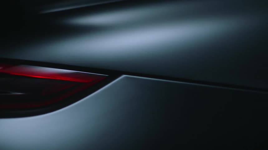 A headlight on a silver car