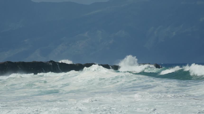 Ocean waves crashing into a shoreline