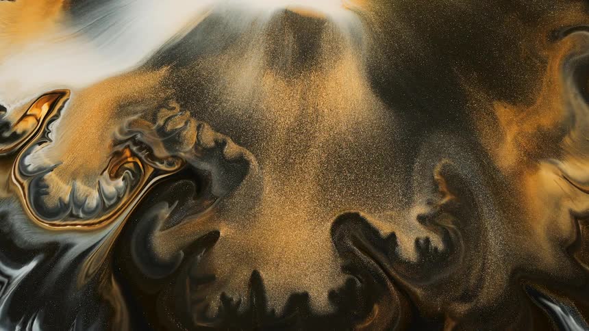 Flowing glittery brown liquid