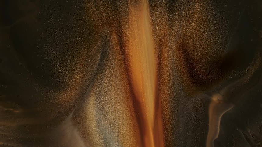 Flowing brown glittery liquid