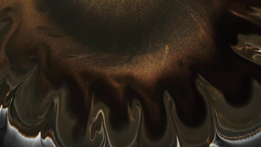 Flowing glittery brown liquid