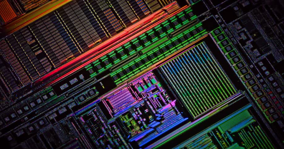 Colorful lights glow and shine on a gridded circuit board