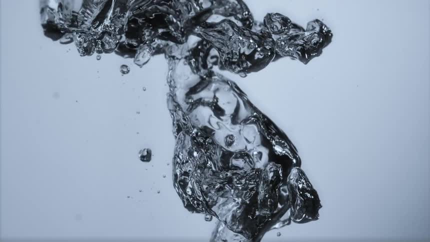 Air bubbles flow upward through water