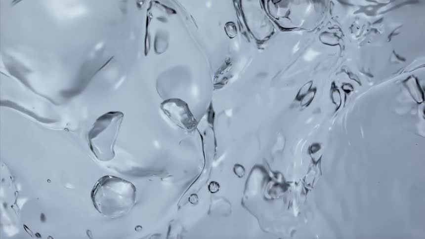 Clear liquid shimmers and bubbles
