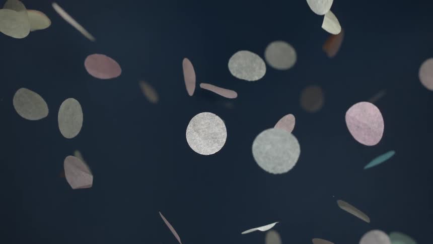 Paper confetti falling in slow motion