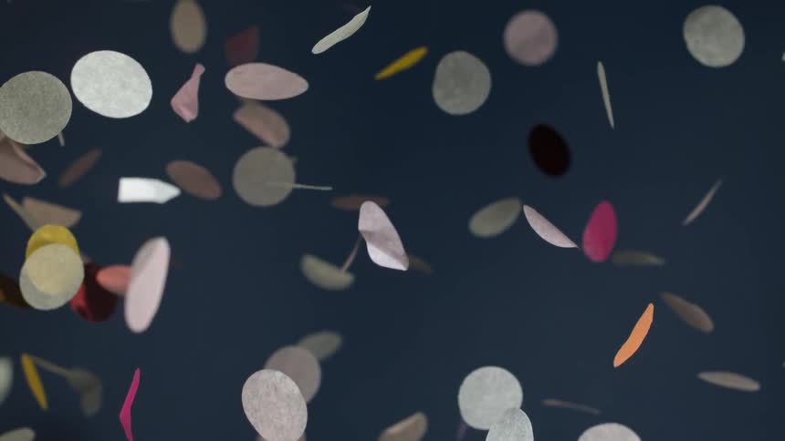 Slow motion view of confetti is displayed