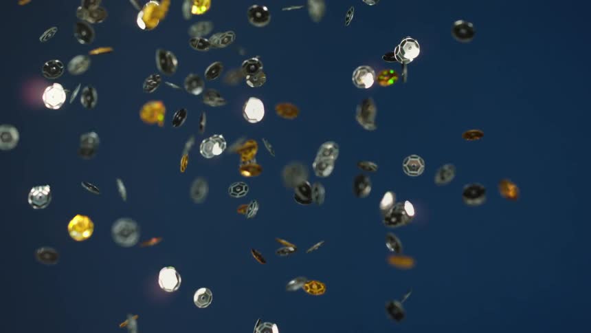 Metallic sequins being thrown in to the air and falling