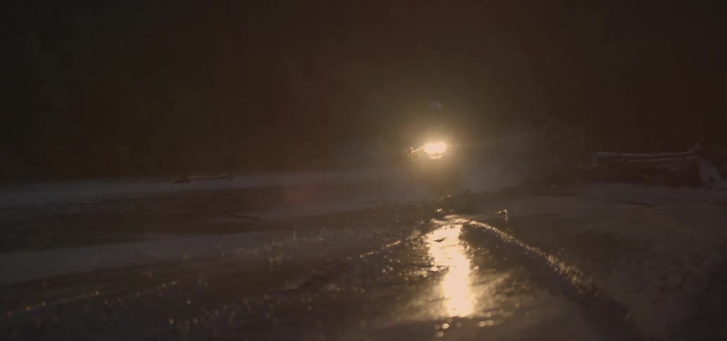 Motorcyclists riding through puddles
