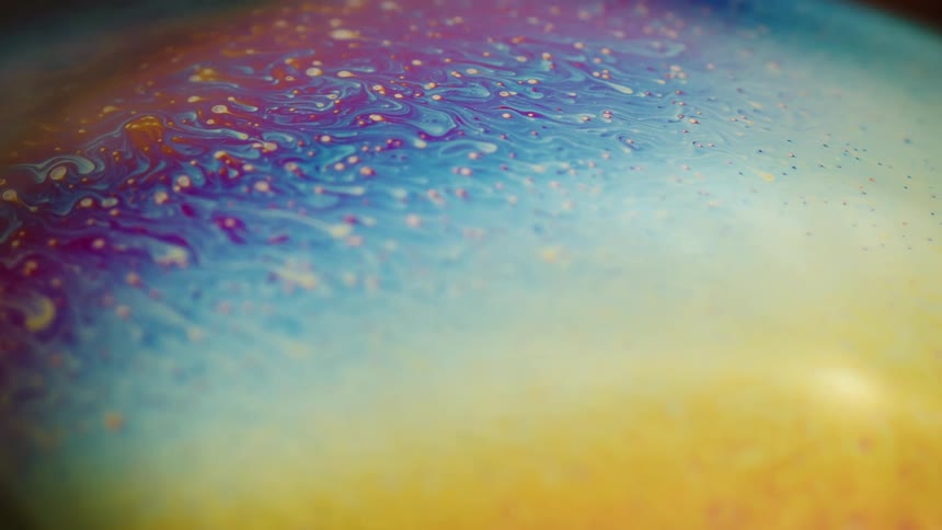 Vividstriated layers swirl on surface of sphere in dark area