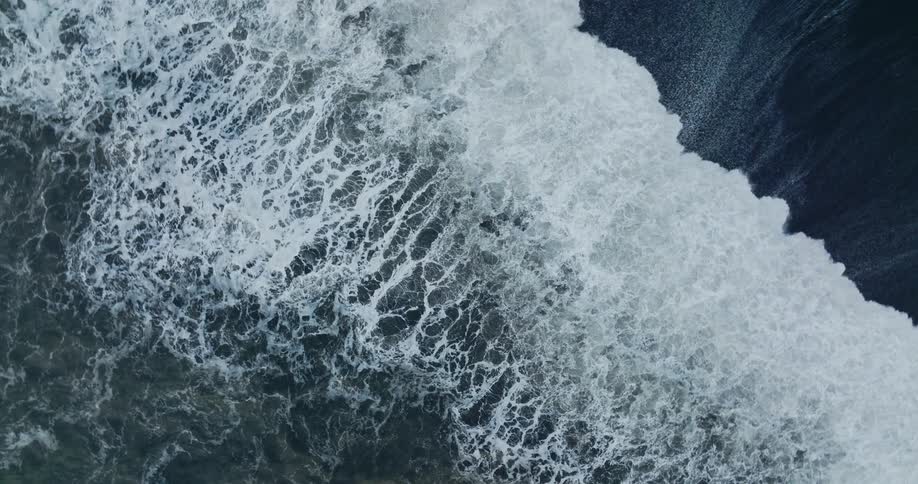 Large waves crash on the shore
