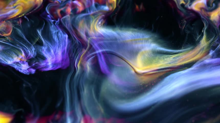 A mixture of vivid colors swirls and expands as if they are cosmic gases