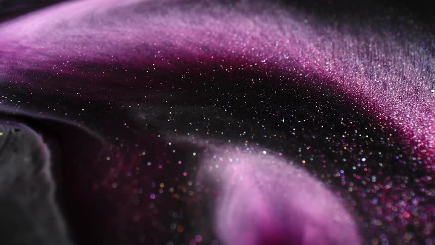 Purple glitter moves in a wave pattern
