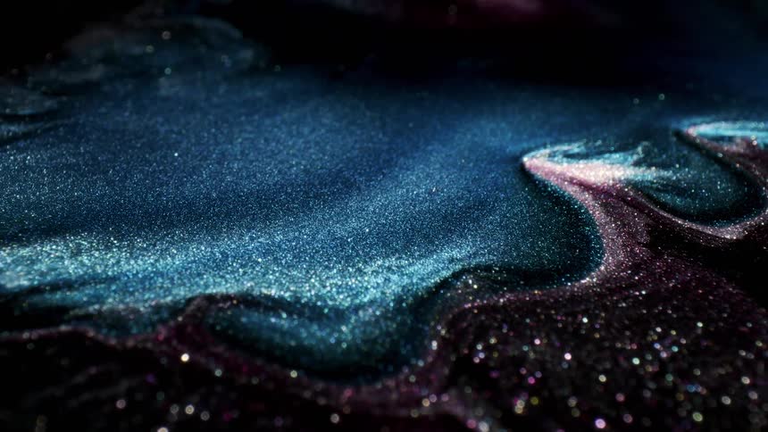 A sea of blue flowing glitter in an abstract topography