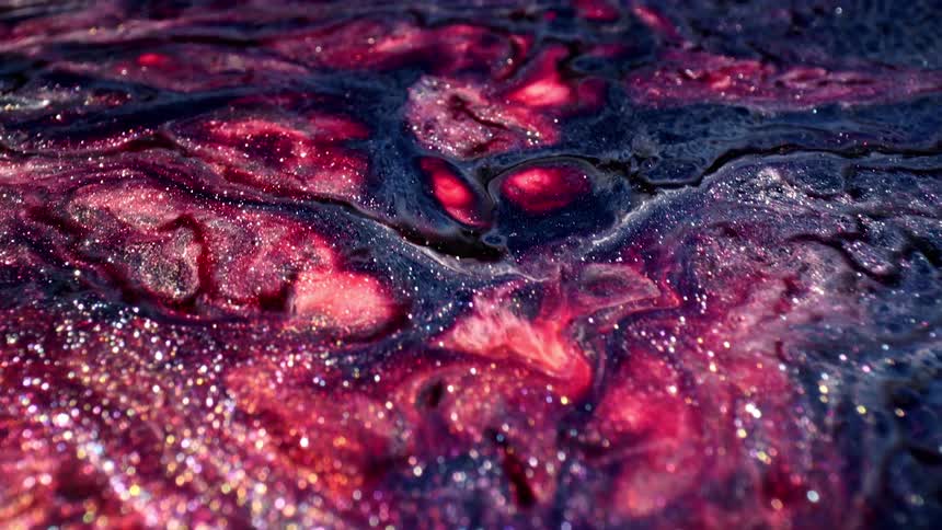 Psychedelic red and blue ink flows like water