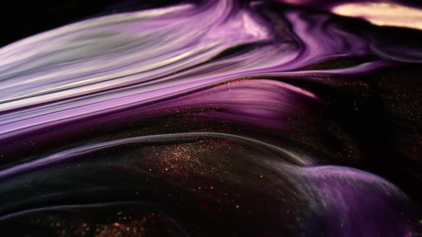 Streams of color and glitter flow in an abstract topography
