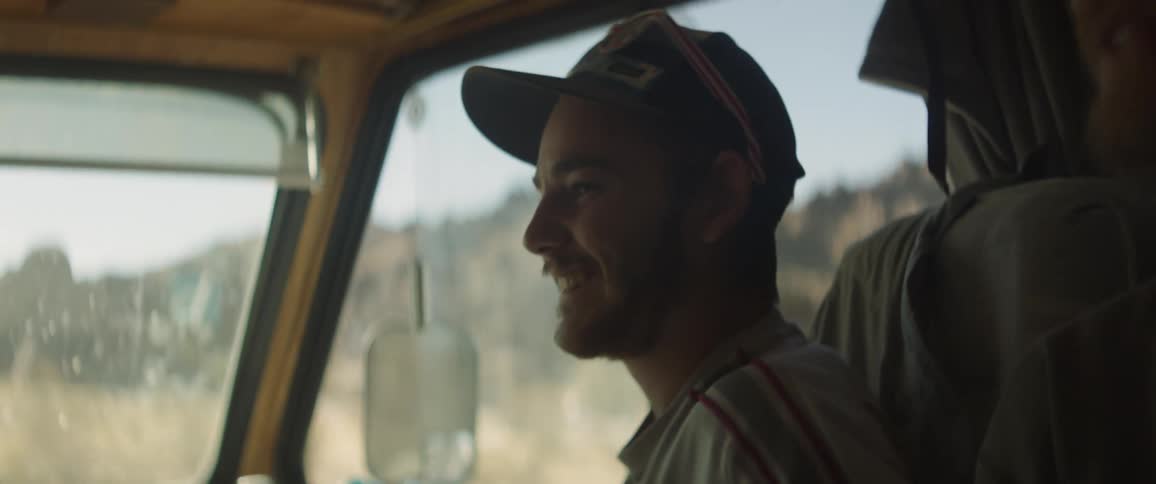 Two men travelling inside a van