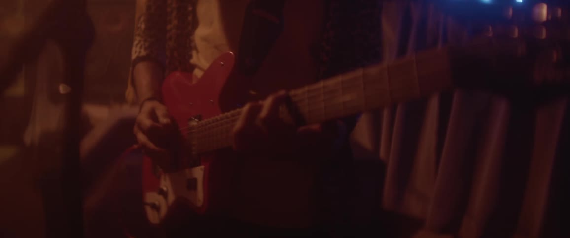 Electric Guitarist plays guitar in trailer
