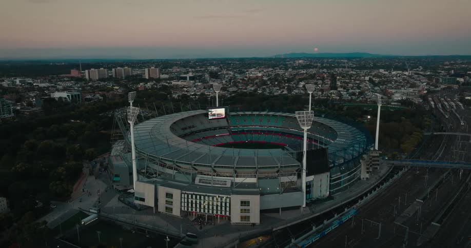 An aerial view of a circular stadium in a city