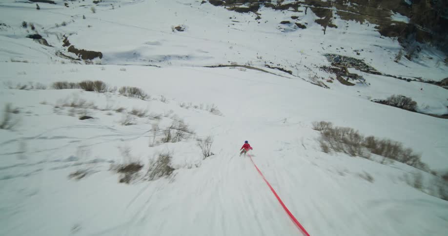A person does a flip while skiing downhill