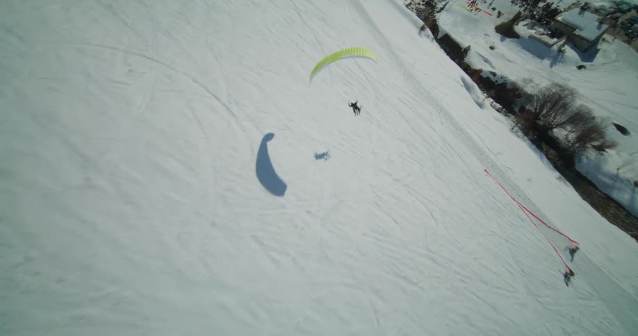 Paragliding preparing a landing on a slope