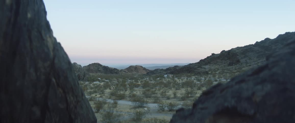 Rocky mountains and shrubs in nature at sunrise