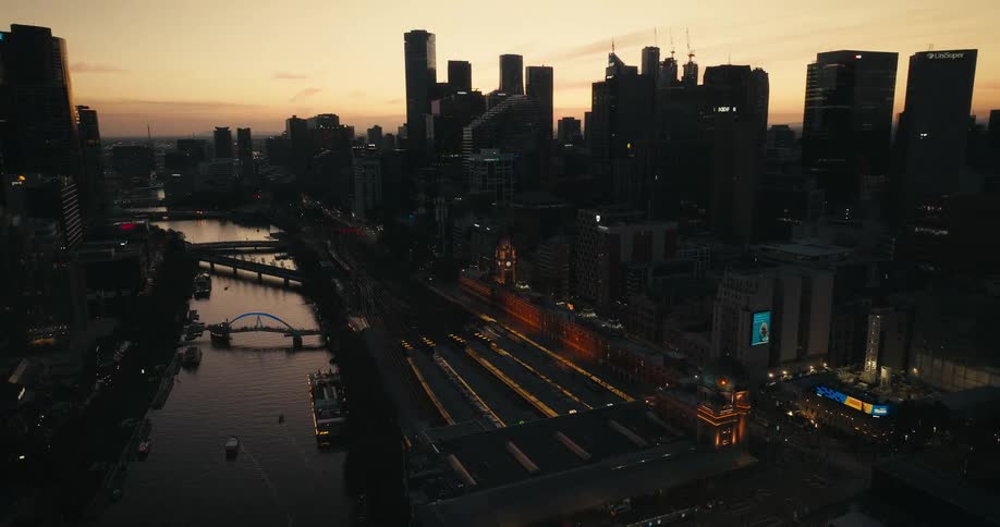 Aerial view of high rise buildings being silhouetted against the sky in the city
